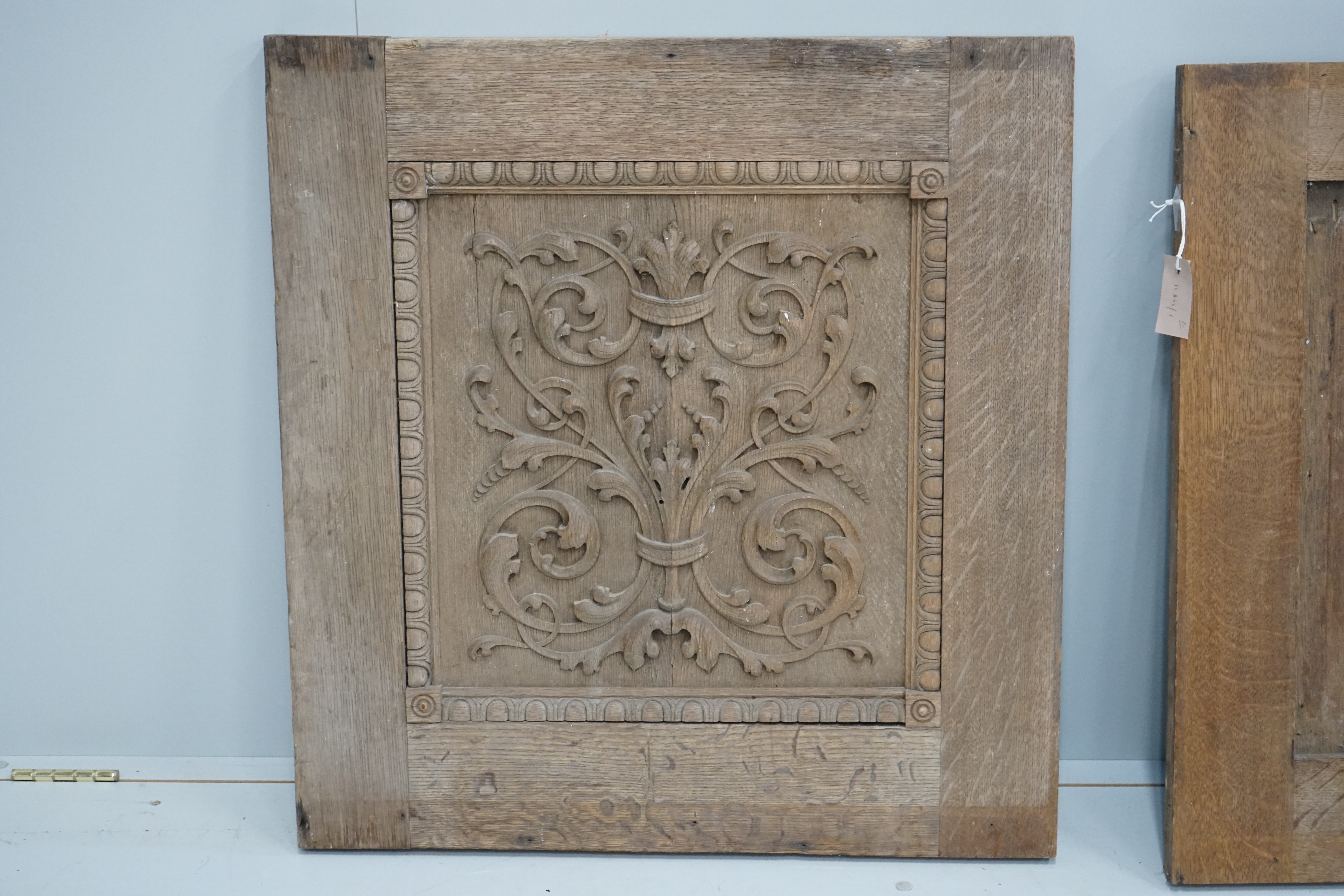 A pair of late 19th century carved oak panels, width 71cm, height 74cm